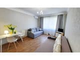 Alex Apartments. White rotunda. 1